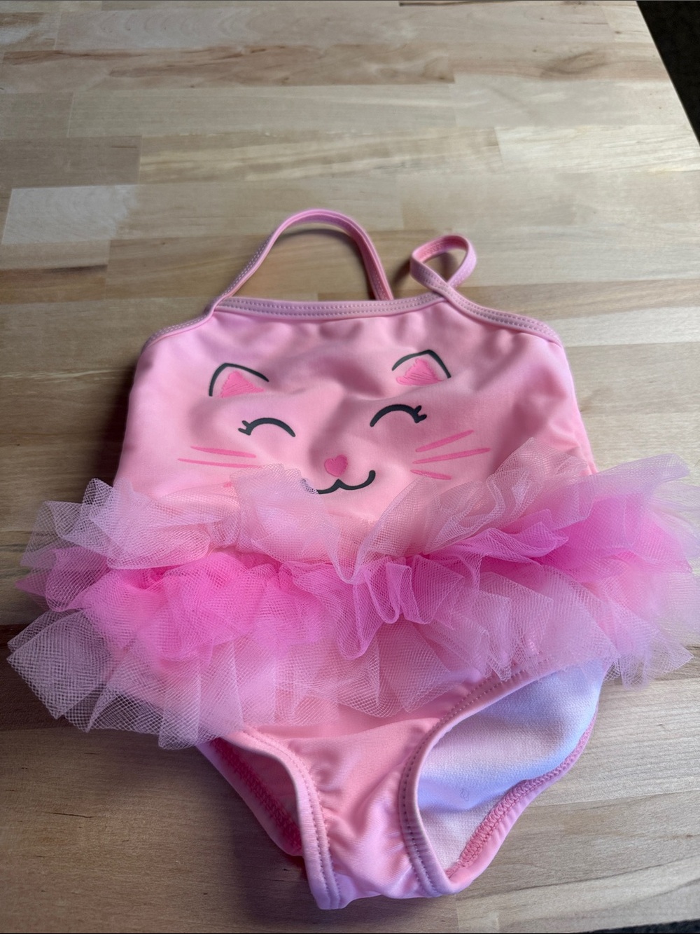 Size 3-6 months adorable cat bathing suit. New without tags